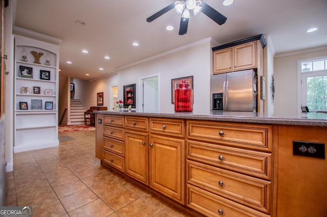 kitchen with stainless steel fridge with ice dispenser, ornamental molding, ceiling fan, and light tile patterned flooring