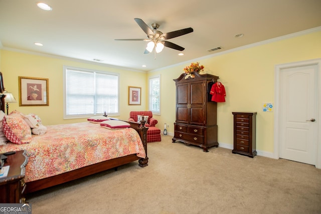 carpeted bedroom with crown molding and ceiling fan