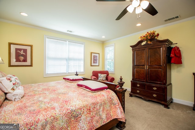 bedroom with ceiling fan, light colored carpet, and ornamental molding