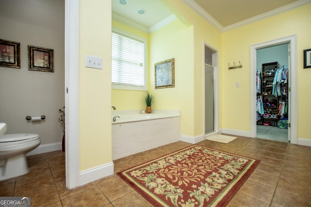 bathroom with crown molding, tile patterned floors, toilet, and separate shower and tub