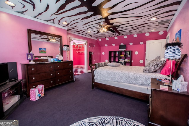 carpeted bedroom with crown molding, a walk in closet, and a closet