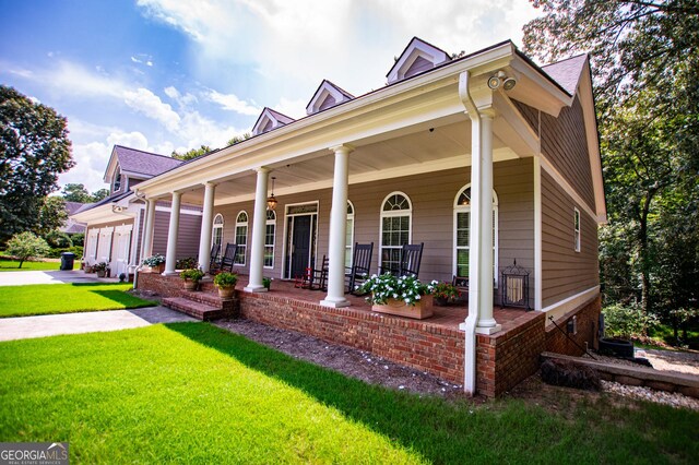 view of front of house with a front lawn and a porch