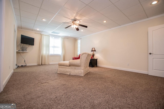 unfurnished room with crown molding, ceiling fan, and carpet