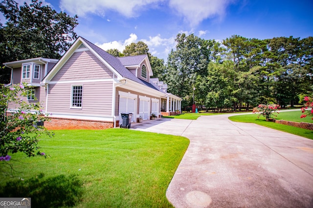 view of property exterior with a garage and a yard