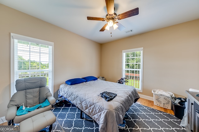 bedroom featuring hardwood / wood-style flooring and ceiling fan