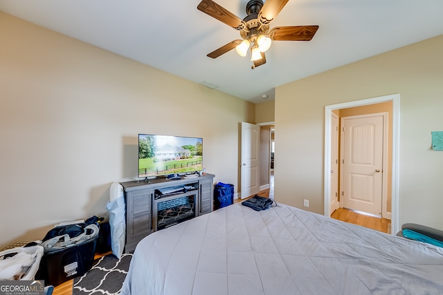 bedroom featuring light hardwood / wood-style floors and ceiling fan