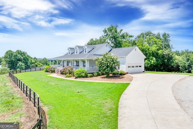 new england style home with a garage, covered porch, and a front yard