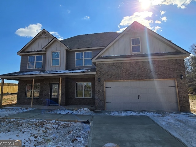 view of front of house with a porch and a garage