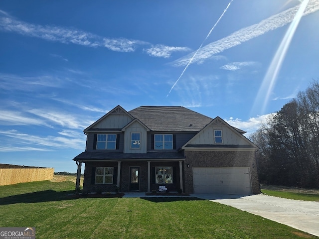 view of front of house with board and batten siding, concrete driveway, brick siding, and a front lawn