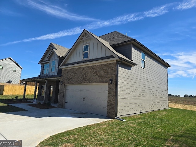 view of front of property with brick siding, concrete driveway, an attached garage, board and batten siding, and a front lawn