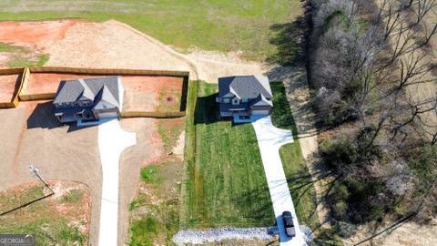 exterior space featuring a garage and a front lawn