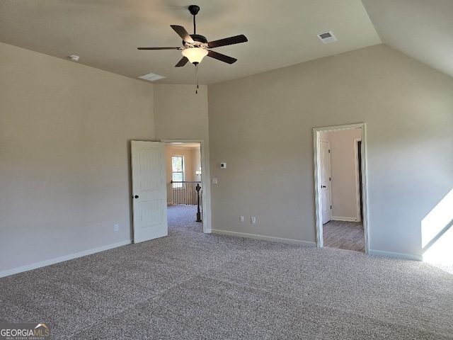 unfurnished bedroom featuring high vaulted ceiling, carpet flooring, visible vents, and baseboards