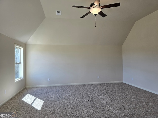 additional living space featuring vaulted ceiling, ceiling fan, carpet flooring, and baseboards