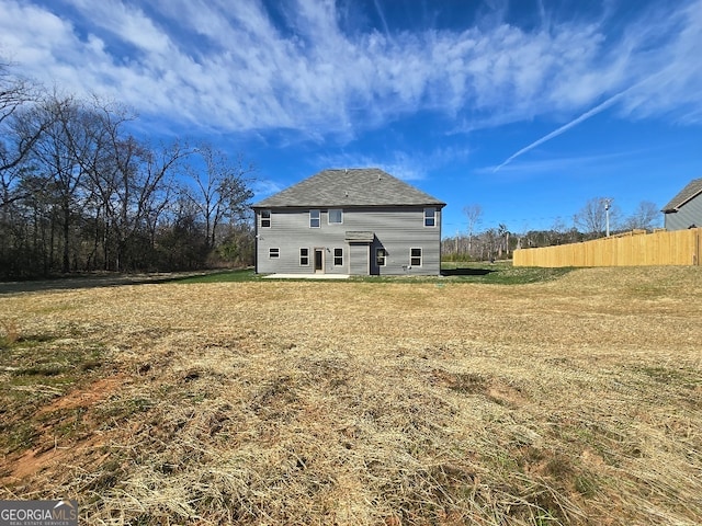 back of house featuring a patio area and fence