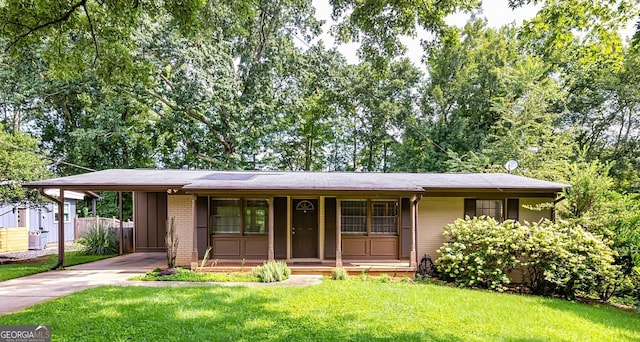 ranch-style house with a carport, a porch, and a front lawn