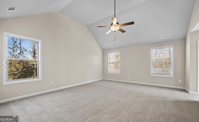 unfurnished room with ceiling fan, vaulted ceiling, and carpet