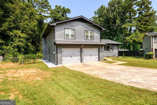 view of front of property featuring a garage and a front yard