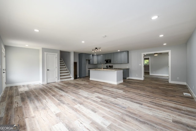 unfurnished living room featuring light hardwood / wood-style flooring