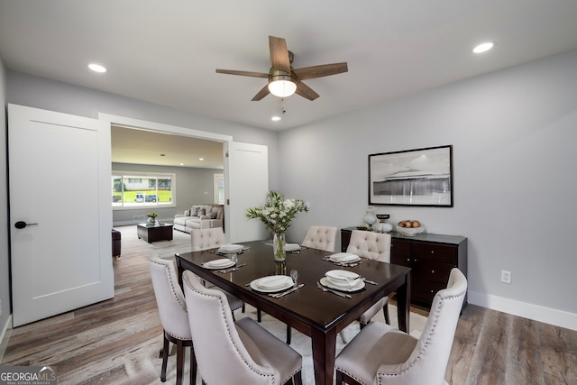 dining room featuring hardwood / wood-style flooring and ceiling fan