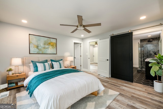 bedroom with wood-type flooring and ceiling fan