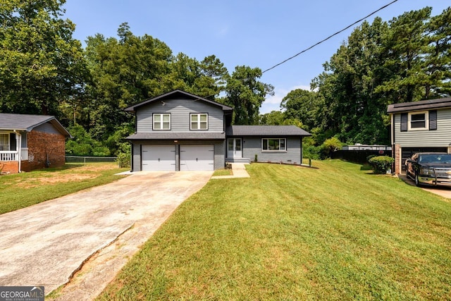 view of front of house with a front lawn and a garage