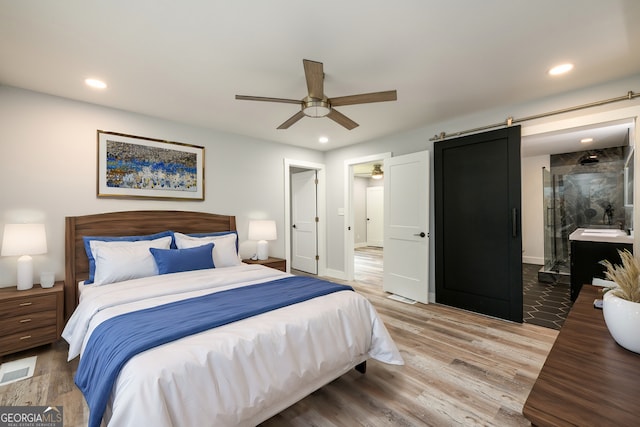 bedroom featuring ceiling fan and hardwood / wood-style floors