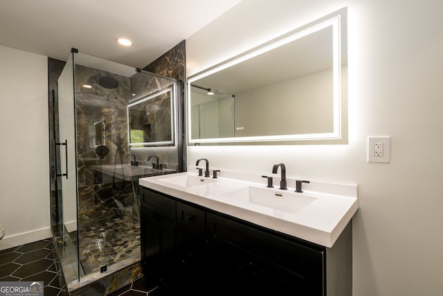 bathroom featuring vanity and a shower with shower door