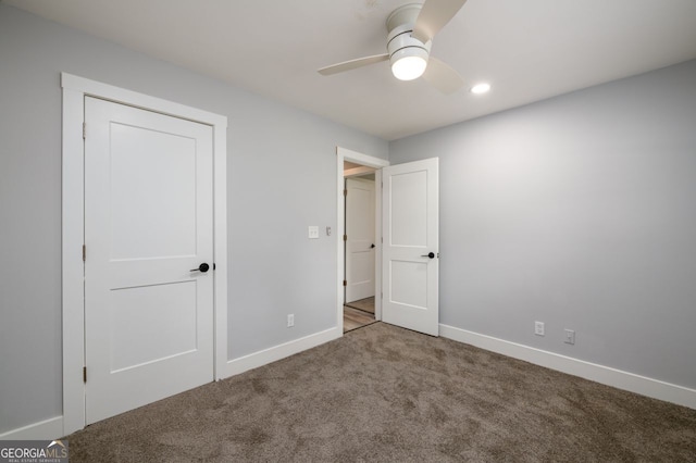 unfurnished bedroom featuring a closet, ceiling fan, and carpet