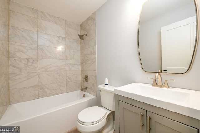 full bathroom featuring vanity, toilet, and tiled shower / bath