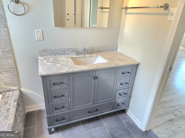 bathroom with vanity and tile patterned floors