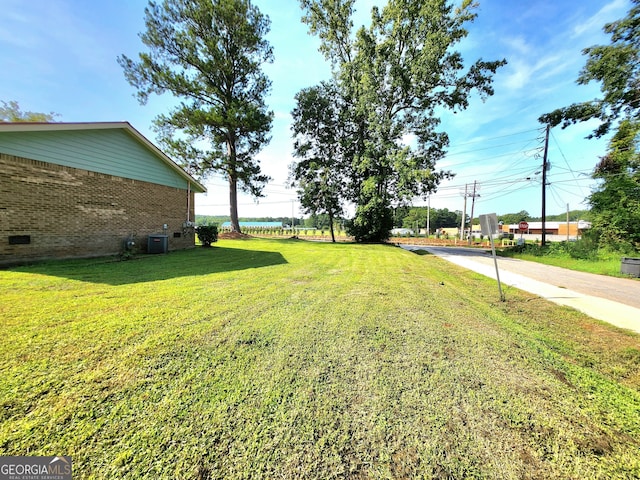 view of yard with central AC