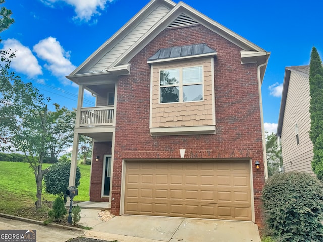 front of property featuring a garage, a balcony, and a front yard