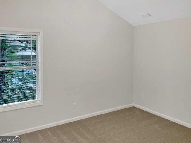 spare room featuring carpet flooring