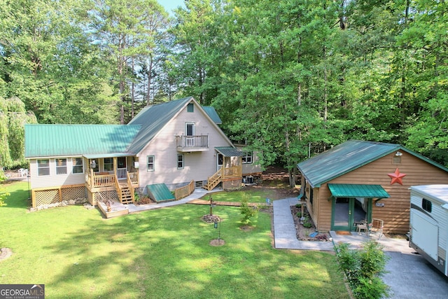 rear view of house with a yard