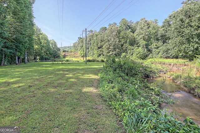 view of yard with a water view