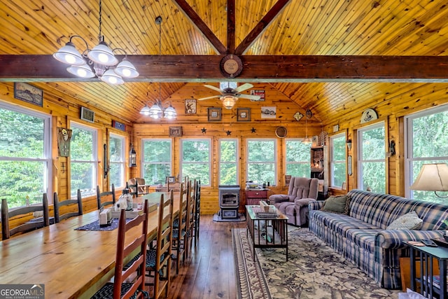 living room featuring wood walls, hardwood / wood-style flooring, vaulted ceiling with beams, and wood ceiling