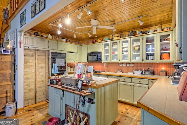 kitchen featuring light hardwood / wood-style flooring, black appliances, rail lighting, wooden ceiling, and ceiling fan