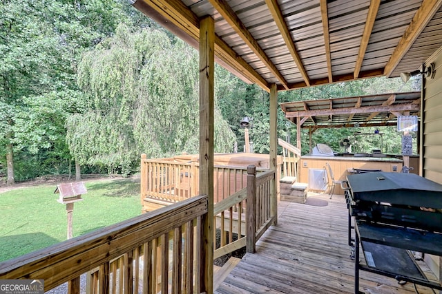 wooden terrace featuring area for grilling, a yard, and a pergola