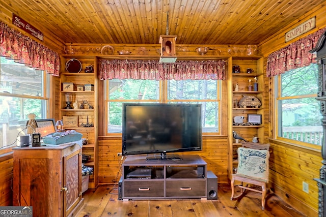 living room with plenty of natural light and hardwood / wood-style flooring