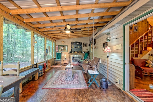 sunroom / solarium with lofted ceiling with beams and ceiling fan