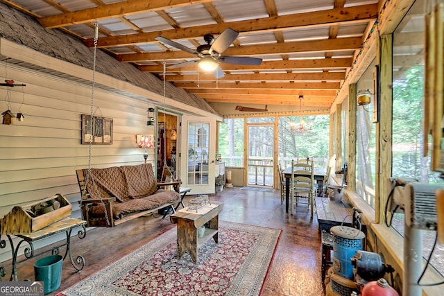 sunroom / solarium featuring ceiling fan and vaulted ceiling