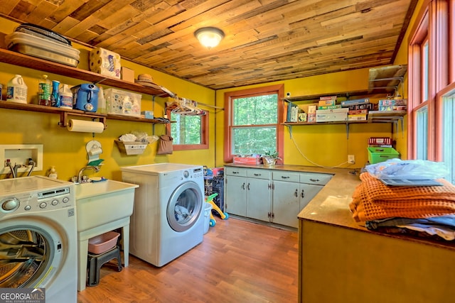 laundry area with hardwood / wood-style flooring, separate washer and dryer, and wood ceiling