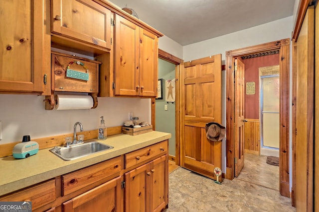 kitchen featuring sink and light tile patterned floors