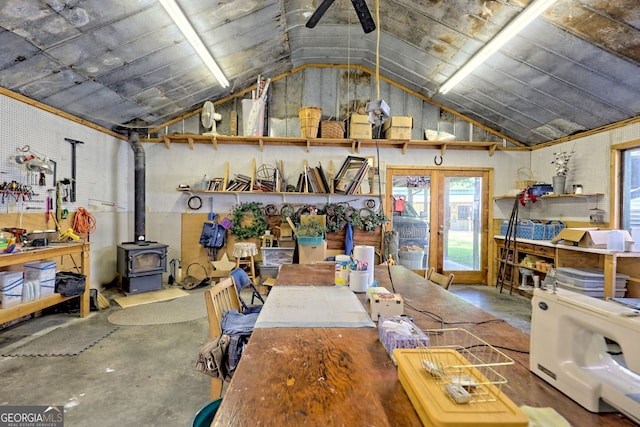 interior space with a wood stove and concrete flooring