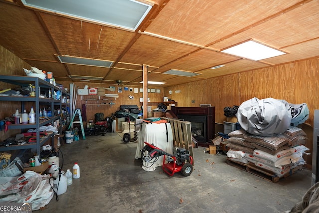 garage featuring wooden walls