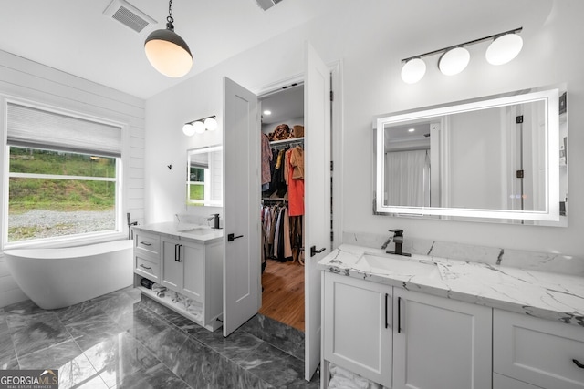 bathroom with vanity and hardwood / wood-style floors