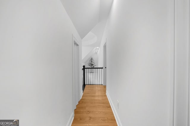 hall with light hardwood / wood-style floors