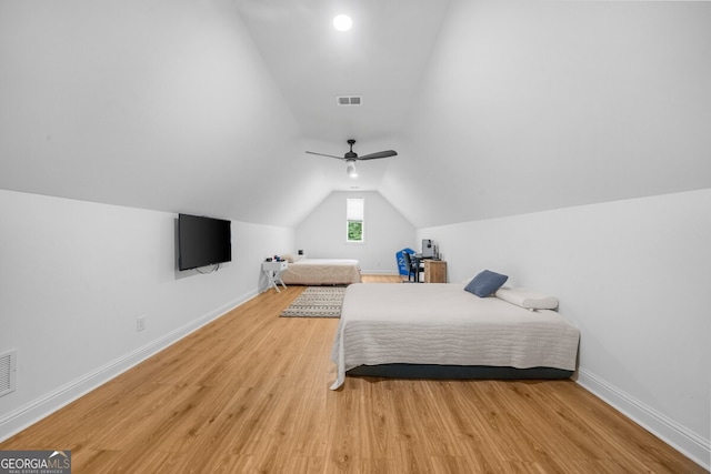 bedroom with lofted ceiling, light wood-type flooring, and ceiling fan