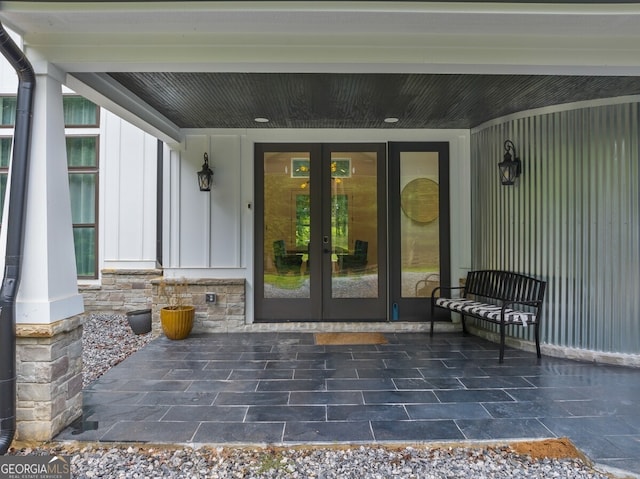 view of exterior entry featuring a patio