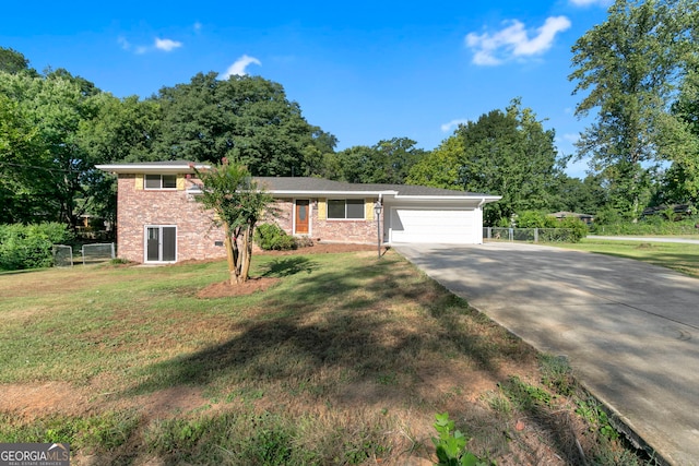 view of front of home featuring a garage and a front yard